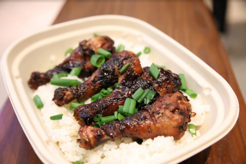 Cooked chicken wings on a bed of rice